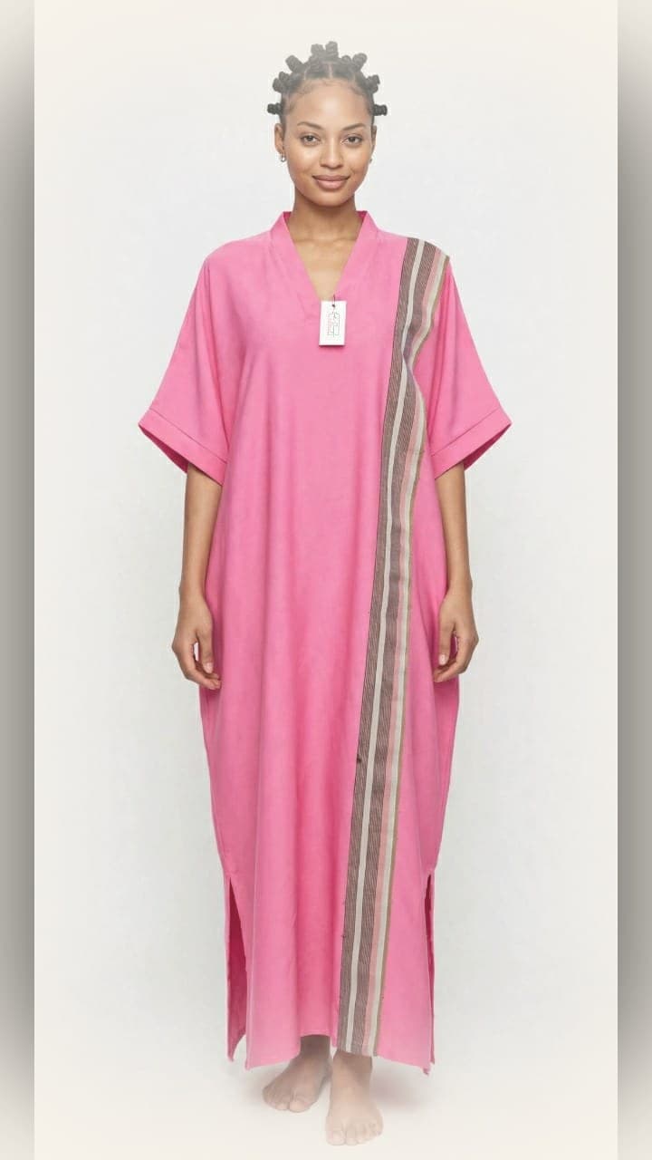 Model wearing the LJ pink striped kaftan maxi dress with vertical multi-colour stripe panel